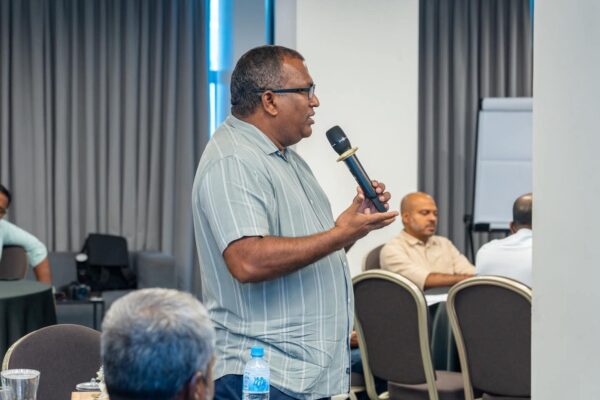 Participant speaking during the stakeholder consultation on long-term leased agricultural islands.